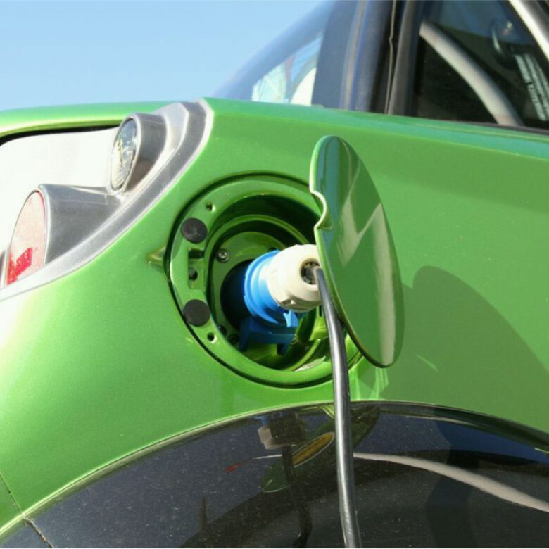 A close up of an electric car charging