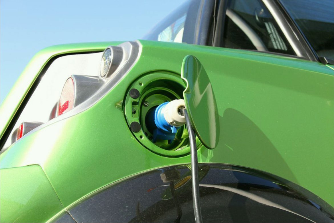 A close up of an electric car charging